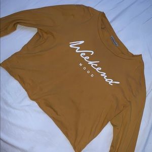 A yellow long sleeve crop top